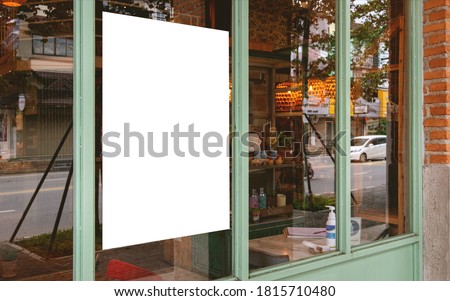Mockup white paper or white promotion poster displayed on the front of the restaurant, coffee shop Promotion information for marketing announcements and details