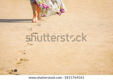 Beautiful footprints in the sand on nature background