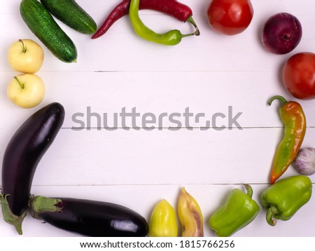 Organic food background. Photo of various fruits and vegetables on a white wooden table.