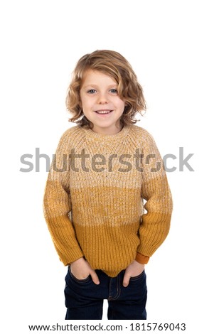 Adorable blond child with yellow jersey isolated on a white background