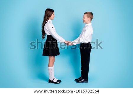 Two Young Girls Holding Hands In Uniform Stock Photos And Images Avopix Com