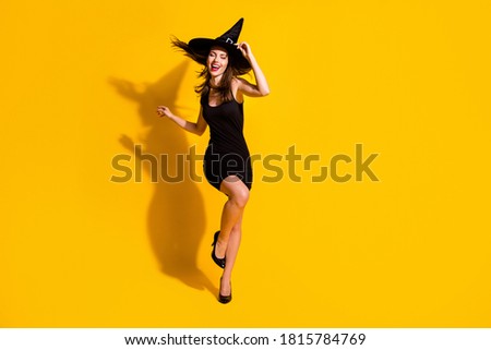 Full length body size view of her she nice attractive pretty slender thin cheerful cheery lady dancing having fun festal occasion event isolated bright vivid shine vibrant yellow color background