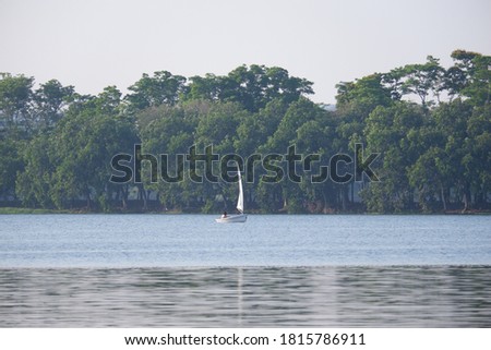 sailing boat in the middle of the lake