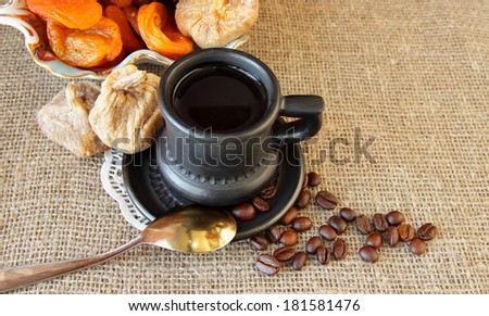 Cup with coffee  and dried fruit 