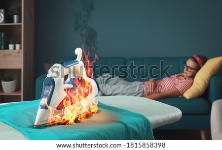 Lazy careless housewife sleeping on the sofa, she left the iron on the ironing board on a dress Royalty-Free Stock Photo #1815858398