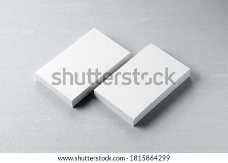 A plain business card on a gray background