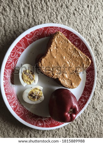 Breakfast Item ,Peanut butter Whit Bread Egg And Apple. 