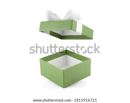 close up open empty green gift box with ribbon bow (lid floating) isolated on white background, square cardboard box wrapped with olive green paper and simple bow for put present in holiday festive Royalty-Free Stock Photo #1815916721