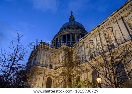 St. Paul's Cathedral in London, UK. Evening view of St Paul's taken from the southeast of the cathedral. Illuminated building, blue sky and clouds.