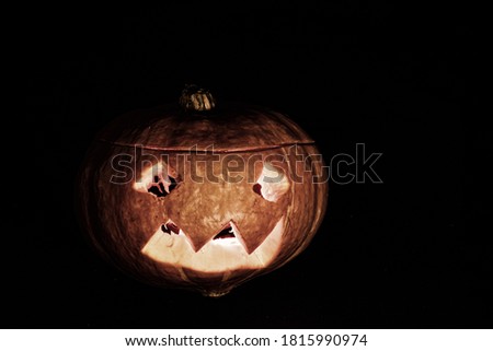 Halloween pumpkins smile and scrary eyes for party night isolated on a black background