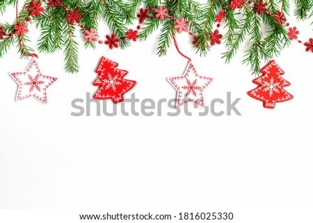 Christmas border made of fir branches, festive red decoration. Flat lay. top view with copy space