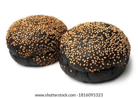 Burger black buns with sesame seeds on white background