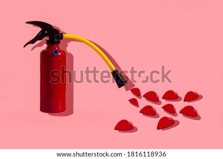 Fire extinguisher with red hearts coming out