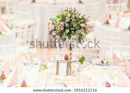 Wedding flower bouquet on a decorated festive table.