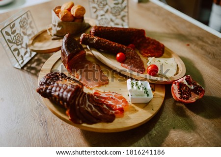 Delicious appetizer served on a plate for a special event. Charcuterie board