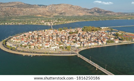 Aerial drone view of the famous island - fishing village of Aitoliko in Aetolia - Akarnania, Greece situated in the middle of Messolongi archipelago known as the Little Venice of Greece Royalty-Free Stock Photo #1816250186