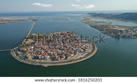 Aerial drone view of the famous island - fishing village of Aitoliko in Aetolia - Akarnania, Greece situated in the middle of Messolongi archipelago known as the Little Venice of Greece Royalty-Free Stock Photo #1816250201