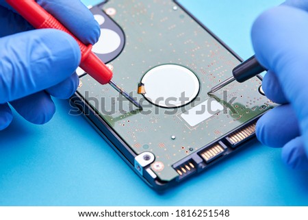 hdd or hard disk drive repair and renovation concept. repairman recover data information from broken hdd.