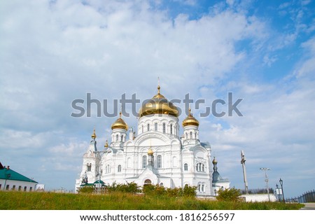 the Belogorsky monastery on the background of blue sky with clouds