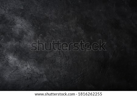 Dark textured concrete wall background. Copy space