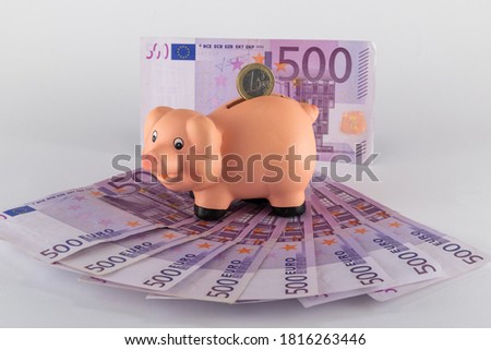 funny image of piggy bank with pig figure and expanded euro banknotes