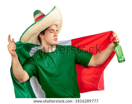 Young Mexican patriot with ranger hat and Mexican flag celebrating El Grito de Independencia with a beer