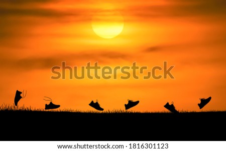 Concept design for Trail running : Silluette running Shoe runnong along the track at the sunset time. Royalty-Free Stock Photo #1816301123