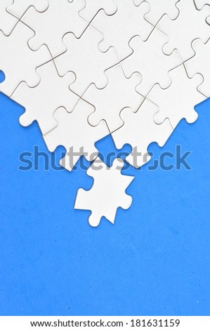 Blank puzzle on blue background