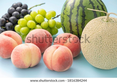 Summer fruits on light blue background.