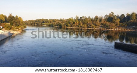 
view of a river called traun in marchtrenk upper austria the picture was taken of a rise at a hydroelectric power plant

