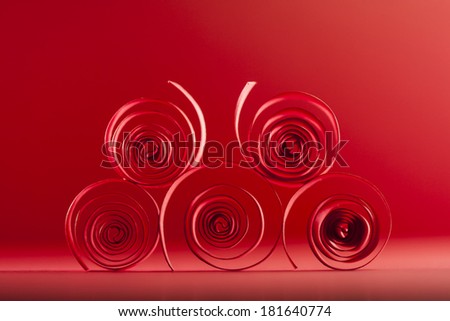 Macro, abstract, background picture of red paper spirals on paper background 