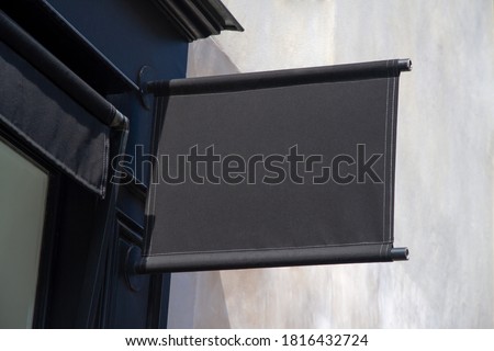 Storefront kakemono Mockup. Black Shop sign on a wall in street template