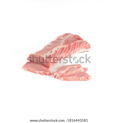 fresh pork loin fillets next to the piece of meat, photograph made on pure white background, for e-commerce, front view