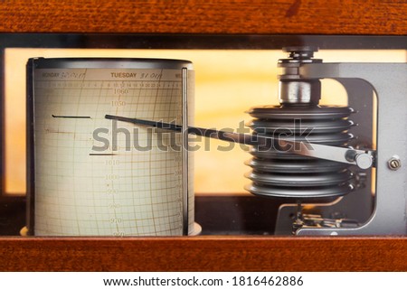 Barograph. The barometer is a self-recording device for continuous recording of atmospheric pressure values. Royalty-Free Stock Photo #1816462886
