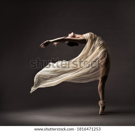 Ballerina Dancing with Silk Fabric, Modern Ballet Dancer in Fluttering Waving Cloth, Pointe Shoes, Gray Background Royalty-Free Stock Photo #1816471253