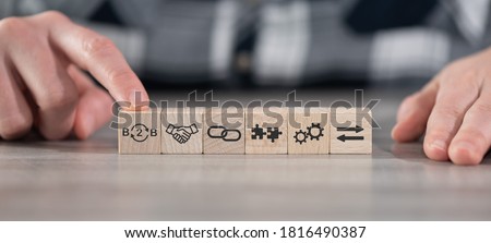 Concept of B2B with icons on wooden cubes Royalty-Free Stock Photo #1816490387