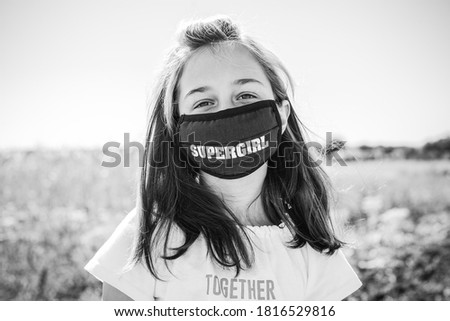 Girl in a medical protective mask. Coronavirus epidemic.