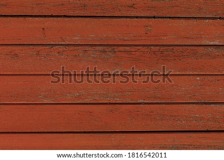 wooden background of red boards. texture of shabby paint 