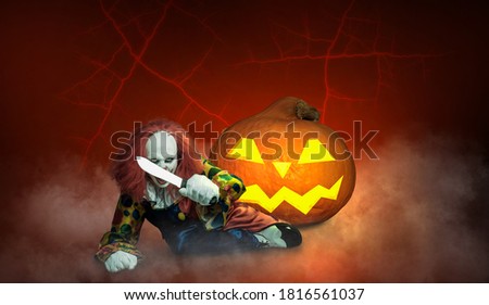 a clown against an abstract background holds a knife in his hand