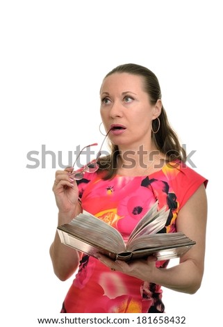 Woman by reading a book and lost in thought took off her glasses