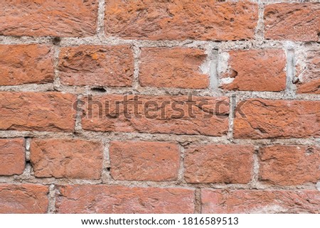
texture of aged brick on the facade of the building