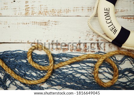 Lifebuoy Marine Decoration with space copy on wooden background