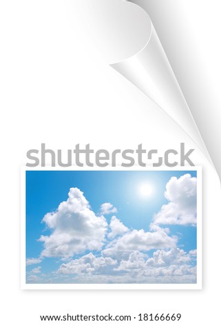 Turning white book page with sky and clowds photo