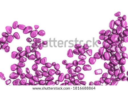 frame of stones in the form of pebbles painted in pink on a white background. flat layout, space for text.