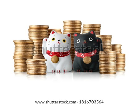 Maneki neko cat and a pile of gold coins, Japanese sculpture Symbolizing luck and wealth.