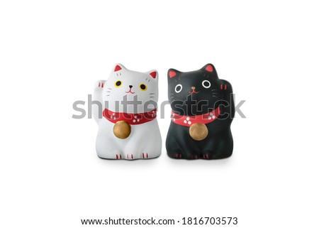 Maneki Neko cat isolated on white with clipping path, Japanese sculpture bring good luck to the owner.