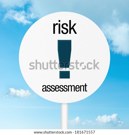 Risk assessment warning road sign with sky as background
