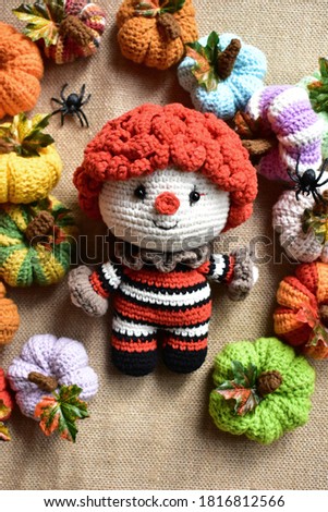 Halloween crochet with cute ghost, pumpkins, clown, spiders, knitting, handmade, kid, childhood, children, funny, toys in vintage background