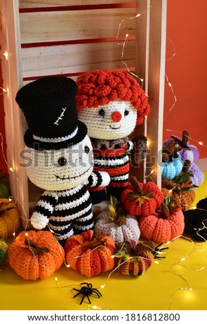 Halloween crochet with cute ghost, pumpkins, clown, spiders, knitting, handmade, kid, childhood, children, funny, toys in orange/ red background