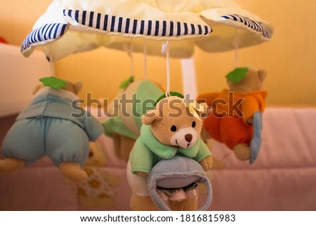 toy for the newborn in the shape of a bear